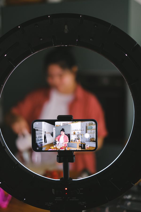 Cooking creator filming with a phone