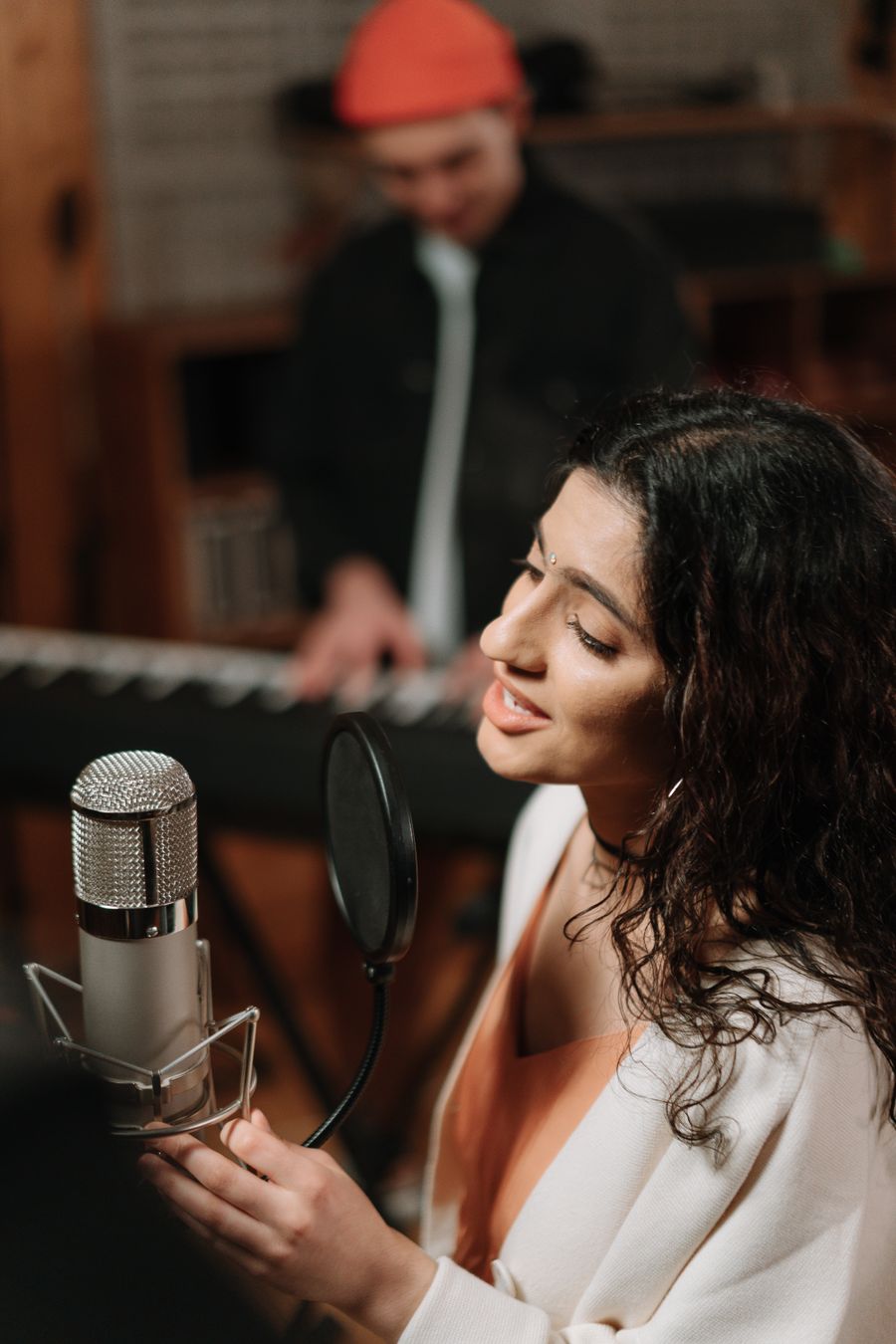 Creator recording at the microphone